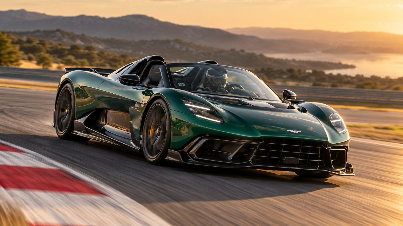 Deep-green Valhalla Spider exiting a corner on a closed circuit